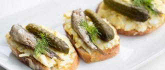 Sandwiches with sprats and pickled cucumber
