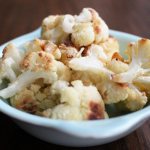 Cauliflower fried with egg in a frying pan